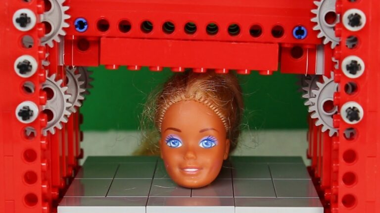 Building Blocks Battle: Lego Press vs Barbie Head Showdown